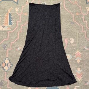 Slinky black on black leopard print midi skirt